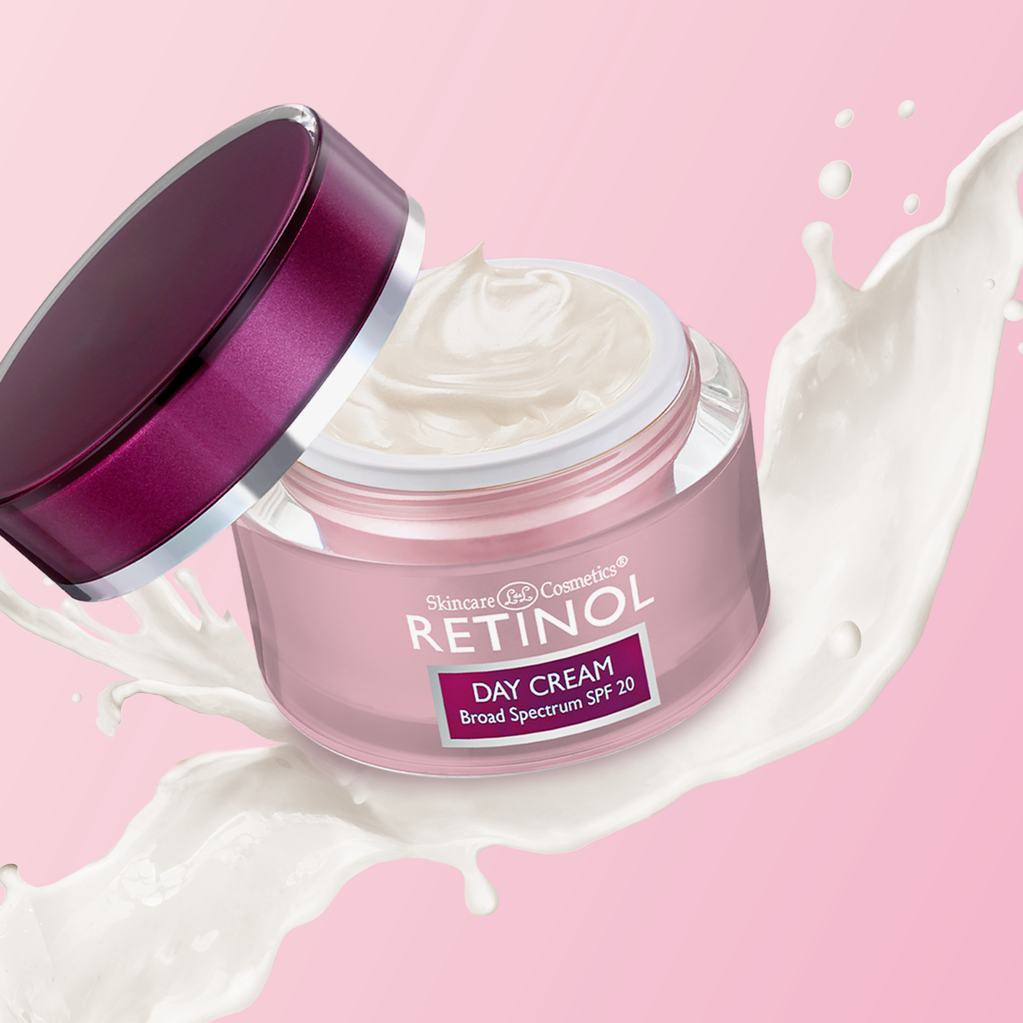 Pink jar of Retinol day cream with a purple lid on a pink background