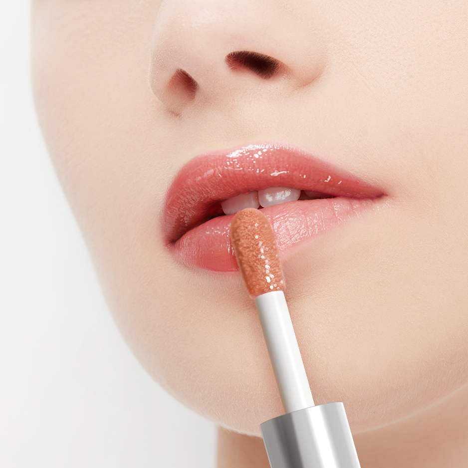 Close-up of a person applying lip gloss with a brush on a light background