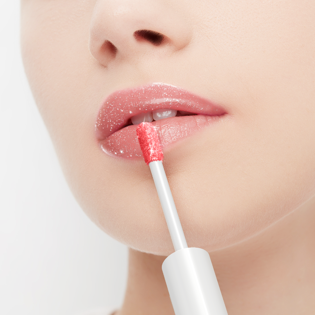 Person applying lip gloss with a brush on a white background
