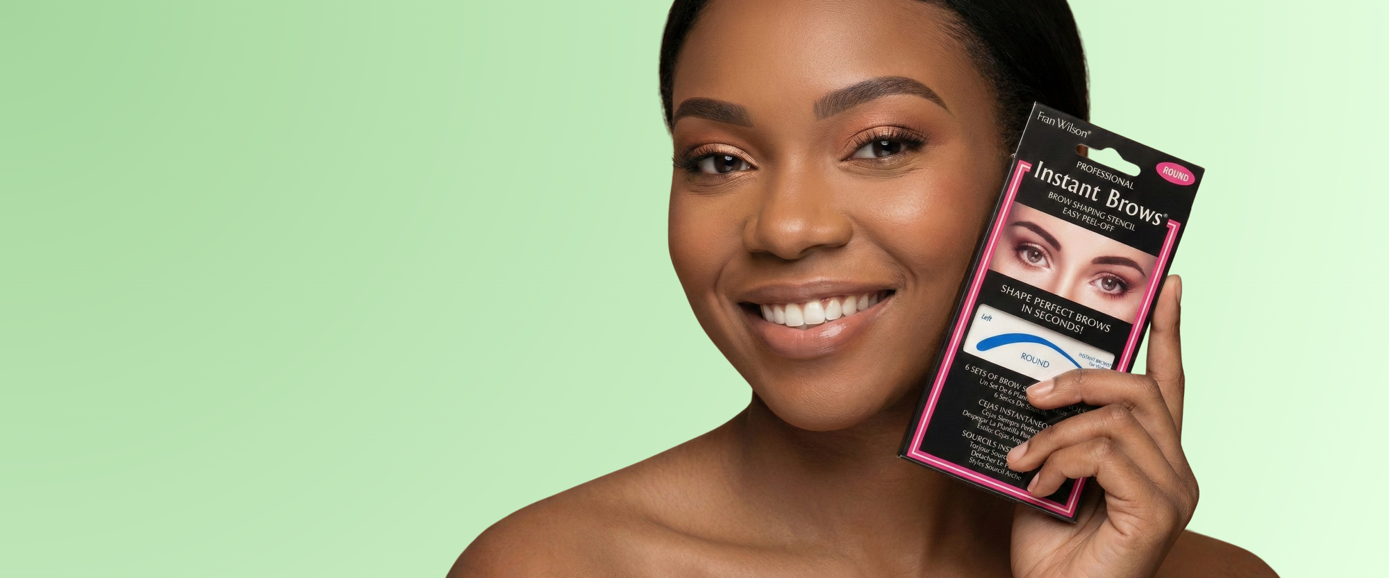 Woman holding a package of Instant Beauty products against a green background